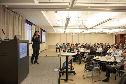Author and entrepreneur Linda Bernardi delivers a keynote speech on innovation to seated audience members during the 2024 Chicago Payments Symposium.